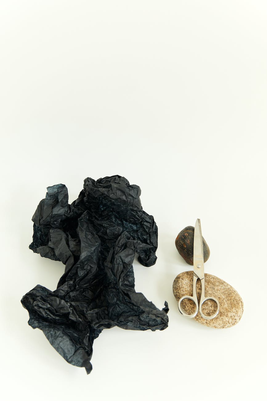 still life with paper rocks and scissors
